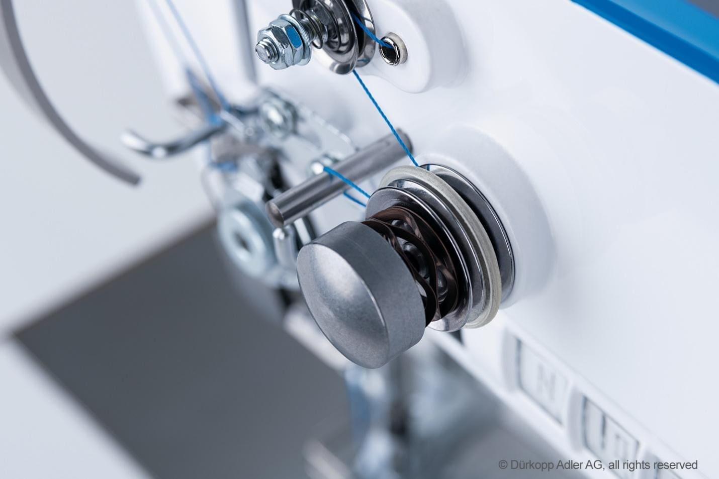 A close up of the side of a sewing machine