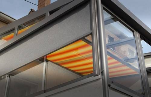 Striped orange and yellow awning on a building balcony.