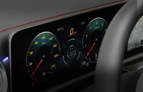 Close-up of a car's digital dashboard showing speed and RPM.