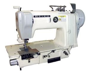 Industrial sewing machine with white body.